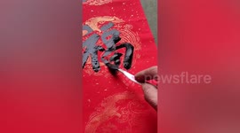 Talented Chinese man uses toothbrush to write couplets