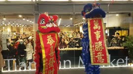 Chinese New Year shoppers entertained by lion dancers and appearance from the Money God in London