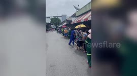 Thai locals form long queue outside dessert shop to buy discounted mango sticky rice