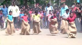 Kids hoped to reach the end point first in a sack race in India