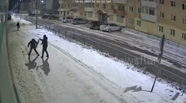 Hilarious CCTV footage captures drunk man staging street fight in the snow