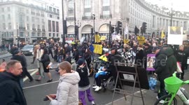 Covid vaccine injury victims throw white roses at Downing Street gates