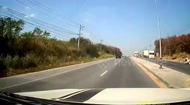 Shocked driver crashes into truck that suddenly turned across inside lane