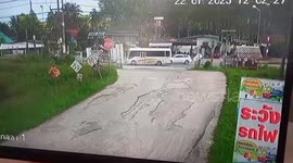 Shocking moment train smashes into pickup truck killing one passenger at level crossing in Thailand
