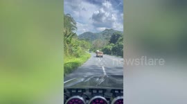 Out-of-control truck veers into opposite lane before crashing into ditch