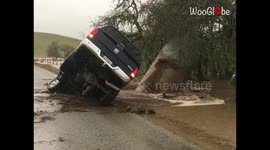 California floods: Car NEARLY eaten up by a sinkhole in Paso Robles *CHILLING shot*