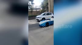 Man rides road with unique car in India