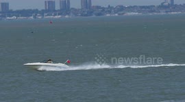 High-speed inflatable wipeout behind speed boat in Kent, UK