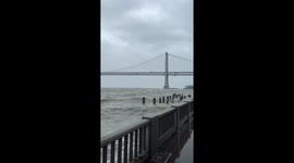 San Francisco woman gets an up-close view of the 'angry sea' from the Embarcadero *Storm Surge*