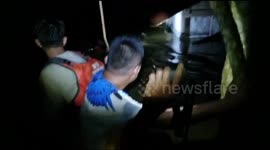 Family rescued from 2-metre-deep floodwater in Indonesia