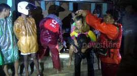 The rescue team evacuated the old grandmother by carrying it