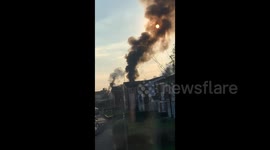 Clouds of black smoke billow into sky as fire rips through flat in west London