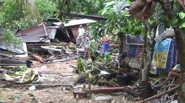 Resident inspect damage after floods ravage their homes in Padang, Indonesia