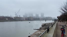 London's skyline shrouded by fog as cold snap continues