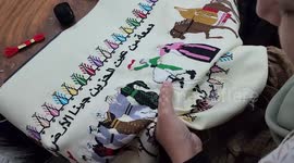Palestinian women learn to embroider and draw as part of a project to empower women