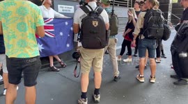 Tense moment as pro-Australia Day protesters stand across road from Invasion Day rally in Sydney, Australia
