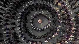 Chinese sing traditional Dong songs while dancing in circles
