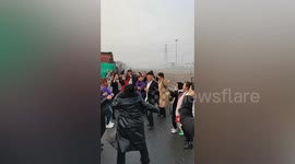 Motorists dance on highway after road closed due to heavy fog in China