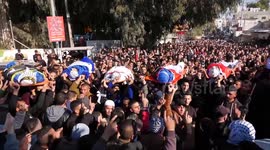 Mourners carry bodies of Palestinians who were killed in deadly Israeli raid