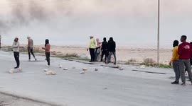 Palestinian protesters clash with Israeli forces accused of raiding refugee camp and killing 9 Palestinians in Jenin