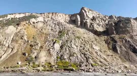 Massive 250-foot wide cliff collapse cuts California beach in half