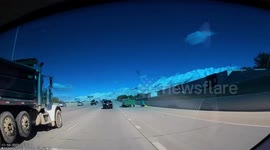 Close Call: White Truck Carrying Trash Nearly Causes an Accident