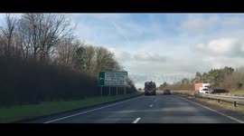 Military convoy on A48 in Carmarthenshire. Three vehicles carrying tanks
