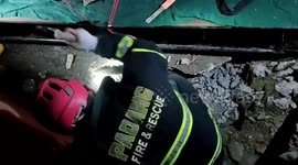 Padang city fire department evacuates a 6 meter long python trapped in a stream