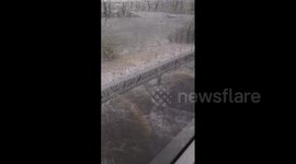 Bus drives through flooded road in Auckland, New Zealand