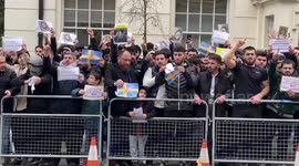Angry muslim protesters burn swedish flags outside London embassy