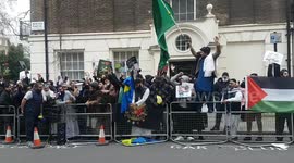 'Shame, shame, shame on you!': Protesters chant and burn posters opposite London's Embassy of Sweden in response to multiple Quran burnings