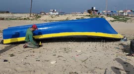 Palestinians fishermen get new outboard engine for their boats at Gaza port