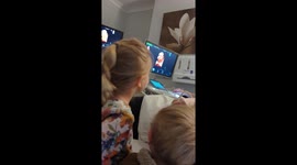 Heartwarming moment sister and brother talk to baby sister during 4D scan