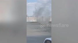 Dust devil tornado tears through car park in Oman