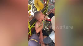 Toddler rescued after getting stuck in rickshaw while playing in Indonesia