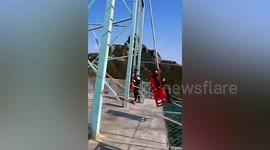 Tourist on swing breaks leg when he collides with steel frame after rope gives way