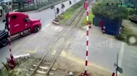 Train hits lorry stuck on level crossing injuring one in Vietnam
