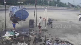 Worker dodges being crushed by half-tonne water tanker that falls from truck