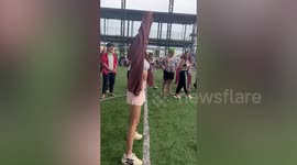 Beauty queen misses penalty and injures photographer crouching beside goal (with slow motion replay)