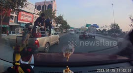 Kind passengers climb down pickup truck to help push stuck driver's broken-down car