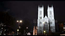 London Double Decker Buses Driving Past Westminster Abbey, London, United Kingdom