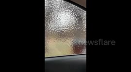 Crazy thick layer of ice forms on car window during storm in Texas, US