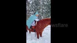 Little girl fulfils dream as she rides horse dressed as Cinderella