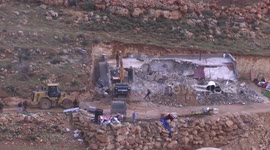 Israeli bulldozers demolish a Palestinian owned house, built without a permit from the Israeli authorities in the area C which lies under their control since 1967, in the West Bank village of Duma