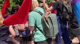 People protest at the funeral of George Pell in Sydney NSW, Australia