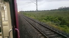 Speedy double Line crossing Trains in India . High speed trains crossing railroad crossing .INDIAN TRAIN