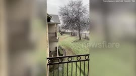 Texas homeowner shows how dozens of icicles have formed on their balcony after cold snap grips the state