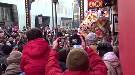 A glimpse of Dragon dance in Soho as crowds celebrate Chinese New Year of the Rabbit