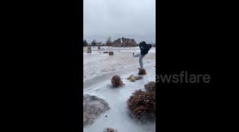 Hilarious scene as US woman slips on ice, sending shoe flying, during cold snap in Haslet, Texas