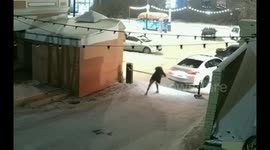 Oof! Drunk woman takes aim at a parking barrier outside a bar in Russia